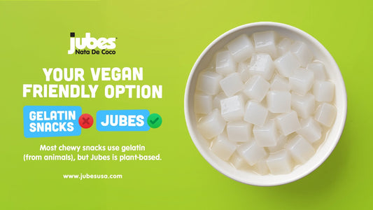 White nata de coco cubes in a bowl on green background with text highlighting Jubes as a vegan-friendly option.