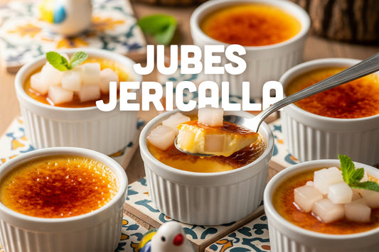Several ramekins of Jericalla custard with caramelized tops, some garnished with coconut jelly cubes, with a spoon lifting a portion from one ramekin and text that reads 'Jubes Jericalla'.