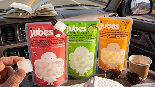 Jubes nata de coco pouches arranged inside a car snack bag during a summer road trip, with coconut jelly cubes