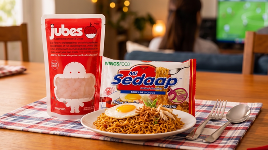 food pairing scene featuring a steaming bowl of spicy Mi Sedaap noodles beside chilled cups of Jubes nata de coco coconut jelly cubes in lychee