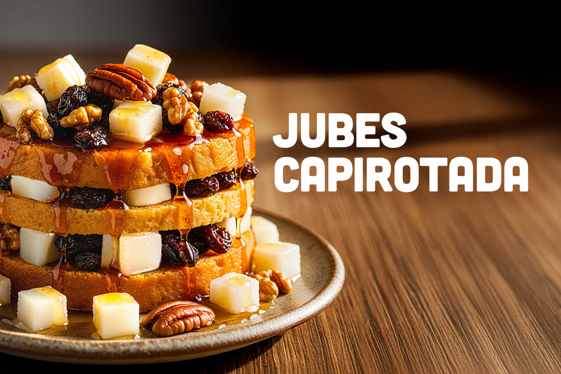 Layered bread pudding dessert with cubes of jelly, nuts, and raisins drizzled with caramel on a plate, with the words 'Jubes Capirotada' beside it.