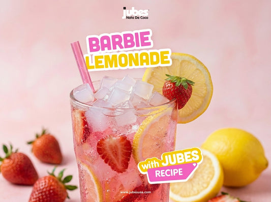 Glass of Sparkling Soda with Lemon and Strawberry topped with Jubes Coconut Gel
